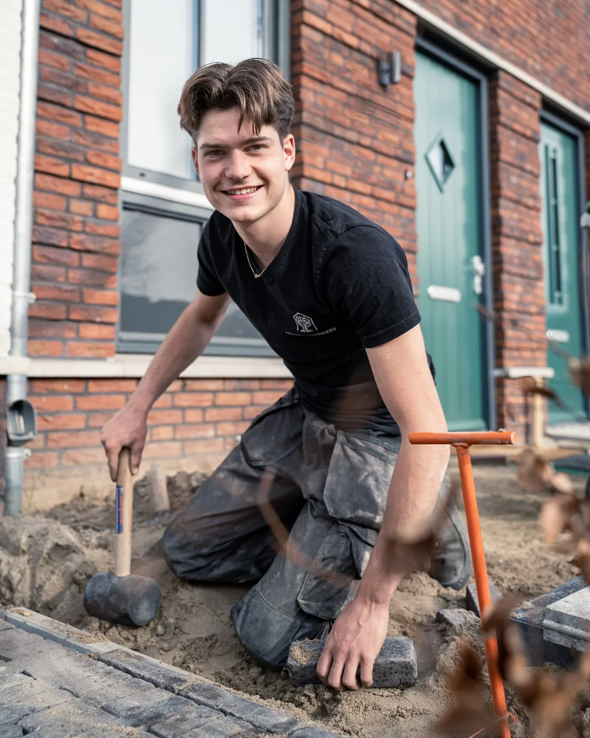 Portrait of a landscaper among paving stones