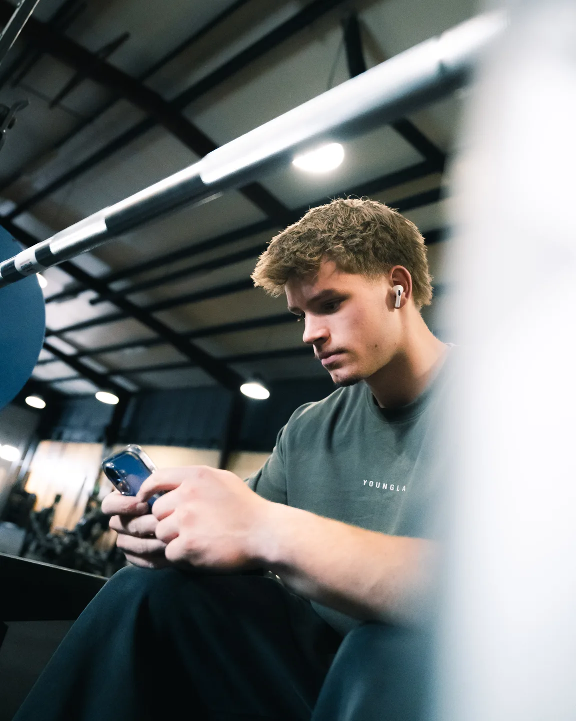 Trainer coaching an athlete with dumbbells