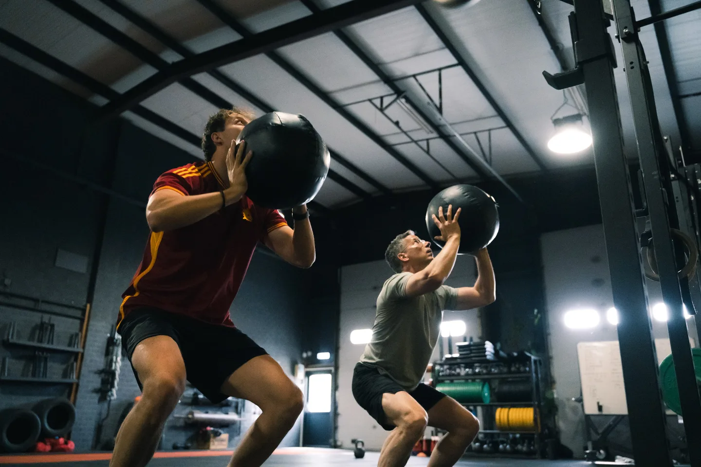 Trainer helping an athlete during an exercise
