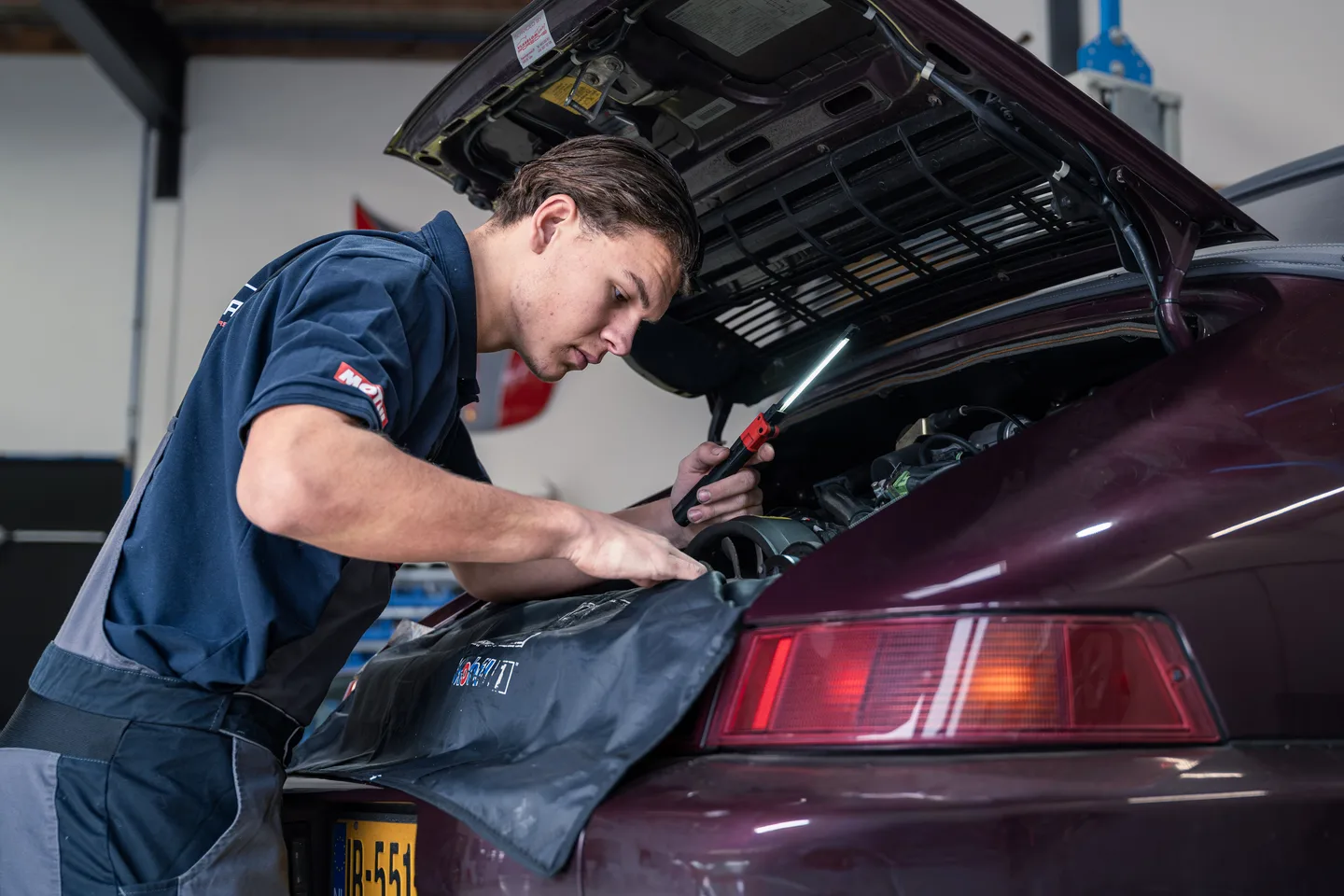 Inspecting bodywork in the workshop