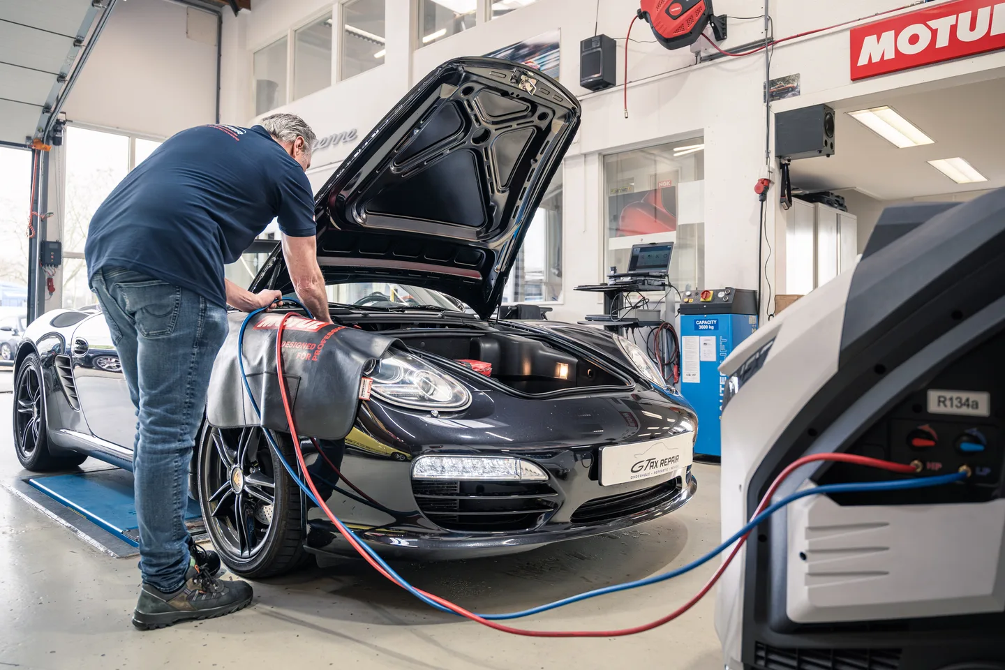 Mechanic carrying out maintenance with workshop equipment