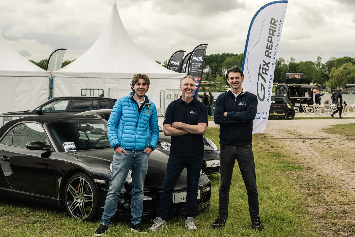 GTAX Repair team beside the company car