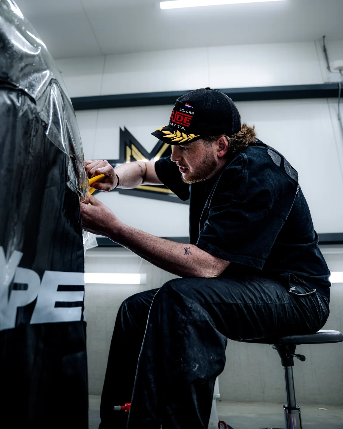 Vinyl wrap being applied precisely to a car door
