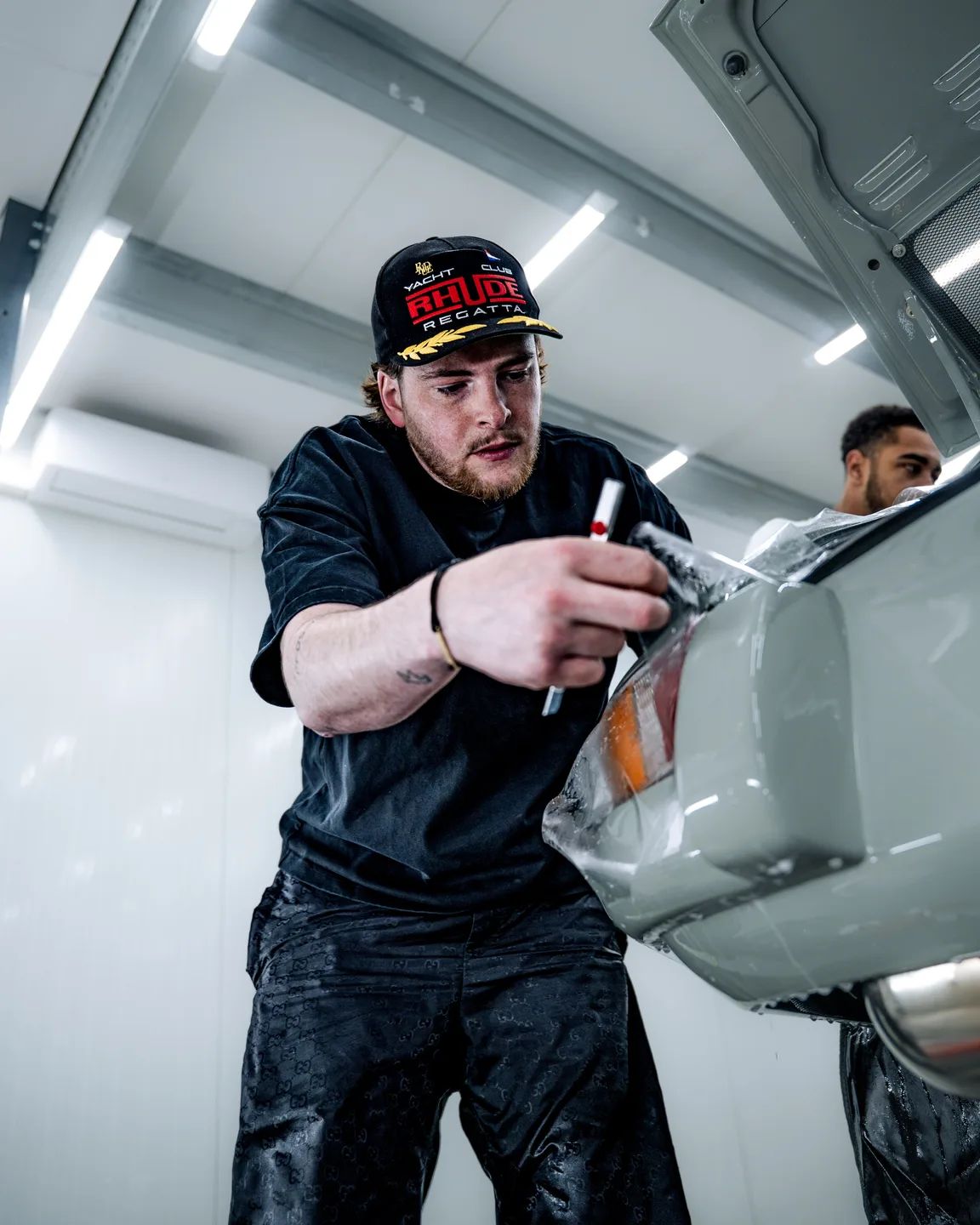Specialist using a heat gun while wrapping a car