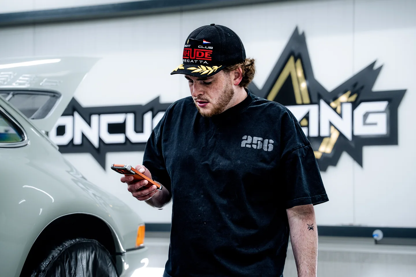 Team member beside a Kroon Customizing vehicle