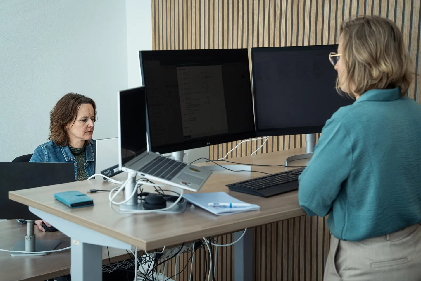 One-to-one conversation at a desk