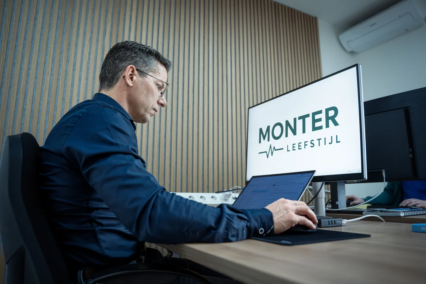 Team member working at a computer