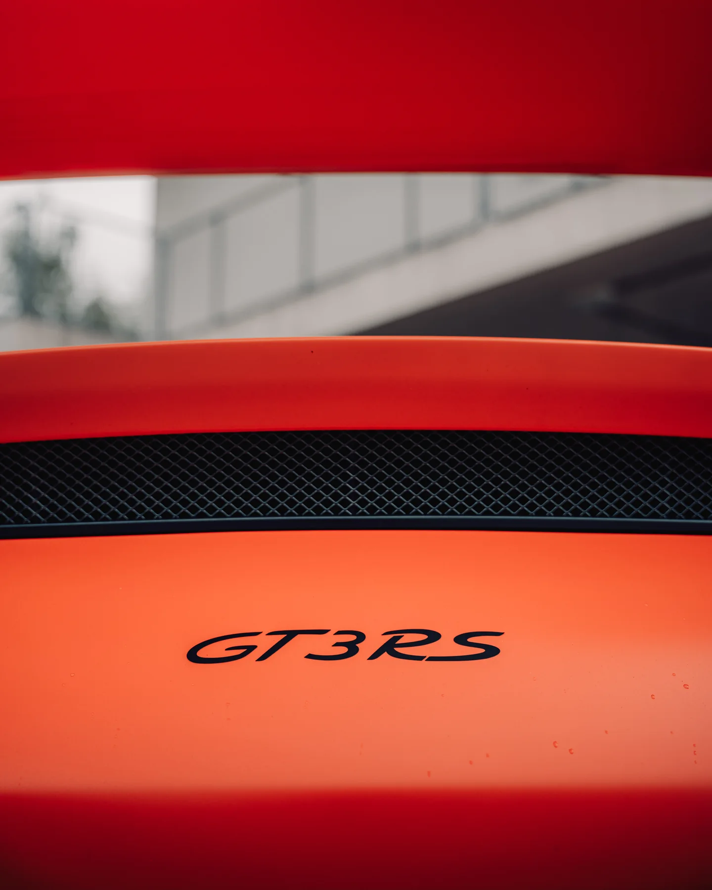 GT3 RS badge detail on orange bodywork